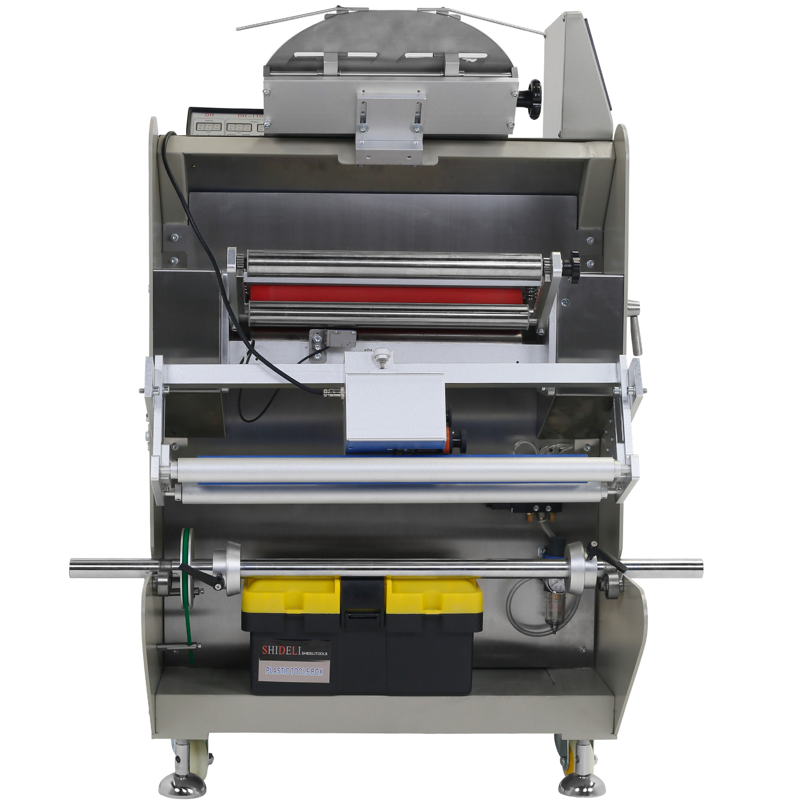 Gray powder coated automatic inclined JORES TECHNOLOGIES® flow wrapper. Showing where to locate the roll of plastic wrap and also shows a box of service tools that is included with the machine