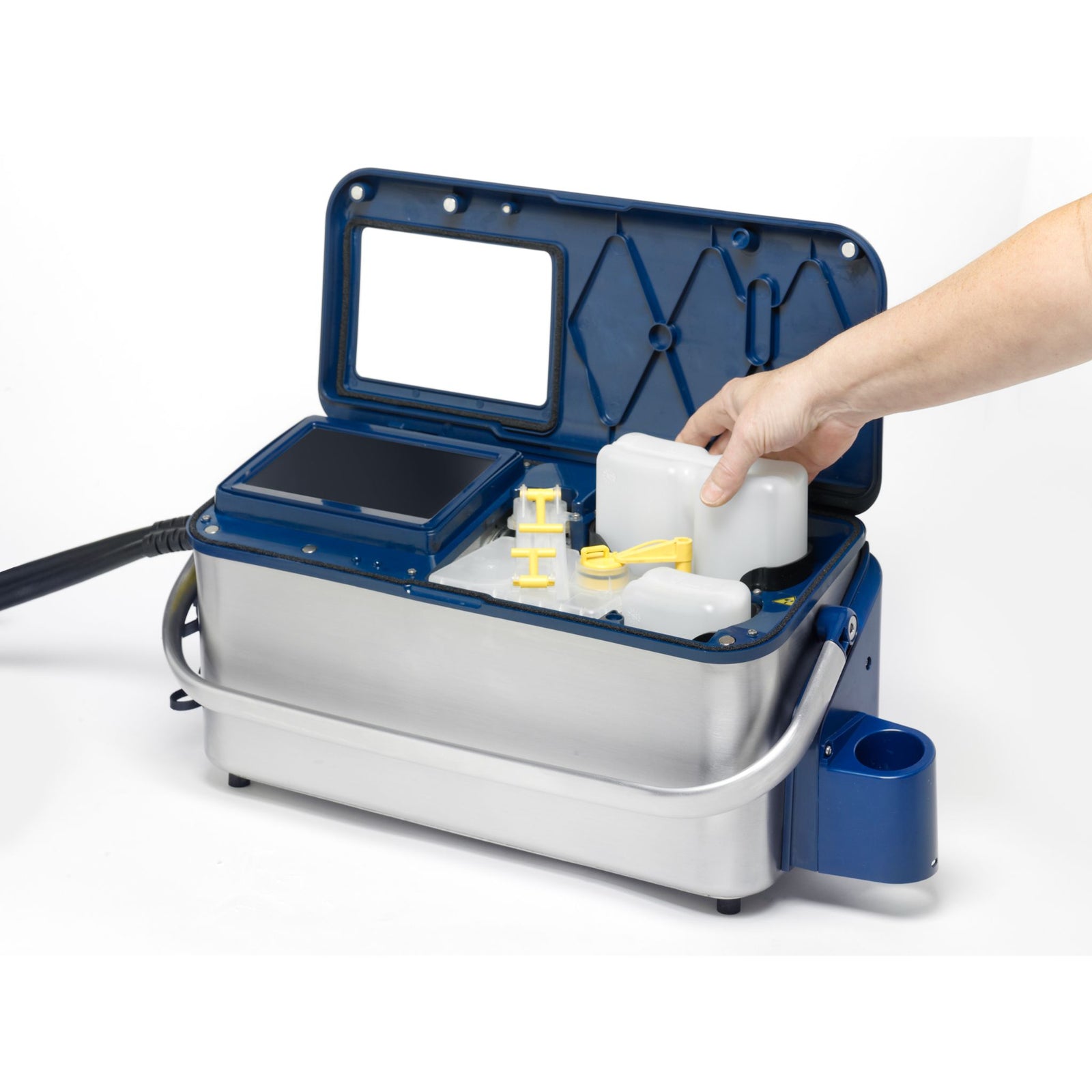 Person replacing a container of bleeding solvent in a LINX 10 Ink Jet Printer