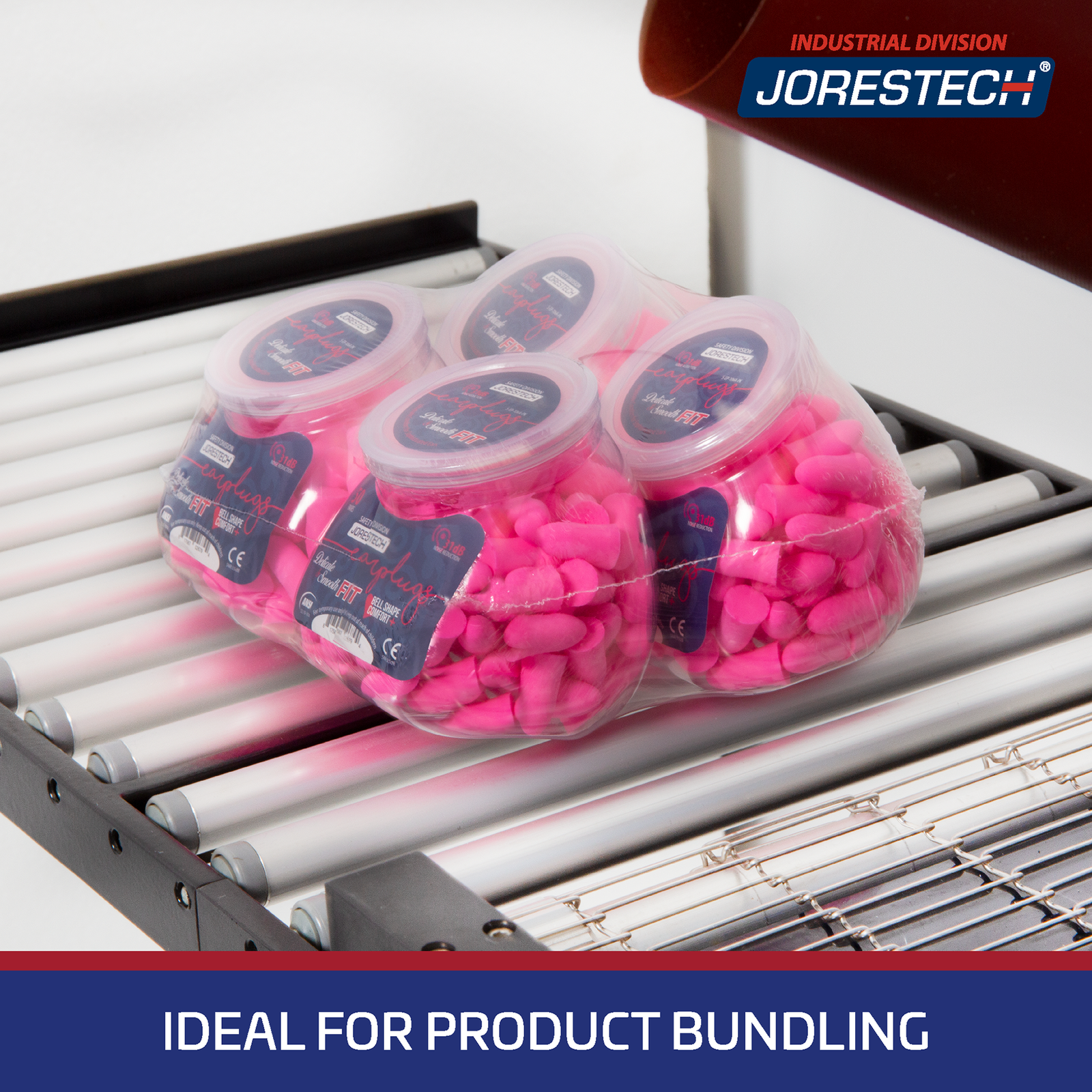 Close up of a group of 4 containers located over the exit roller conveyor of the shrink system packed all together with shrink film in a bundle