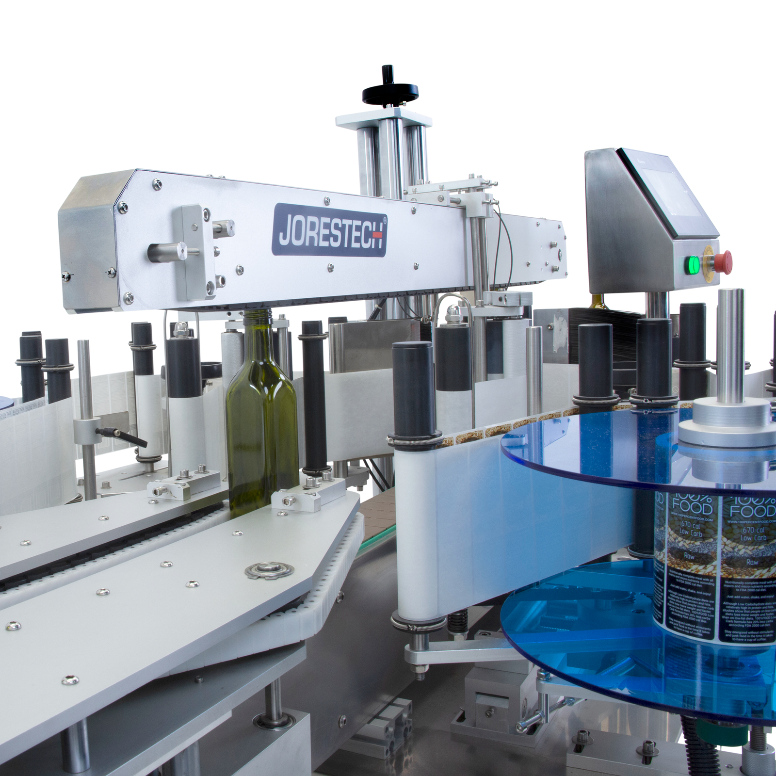 Close up of the JORES TECHNOLOGIES® dual automatic label applicator placing 2 stickers at the same time on a series of flat green glass bottles.
