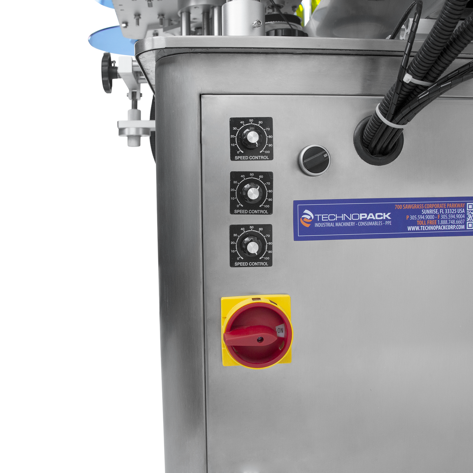Close up showing speed adjusting knobs and red on and off switch on the JORES TECHNOLOGIES® stainless steel dual automatic labeling system