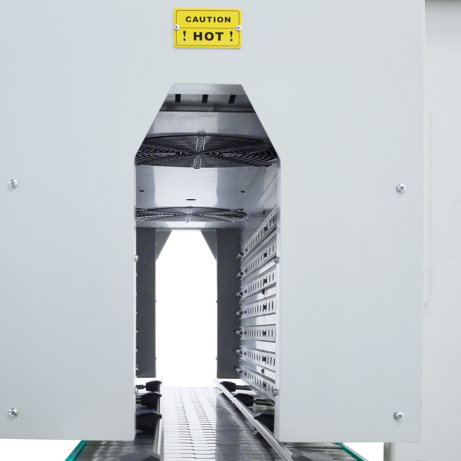 Closeup of the JORESTECH sleeve wrapping tunnel opening where the internal fans, the conveyor, and the adjustable air handling system can be appreciated