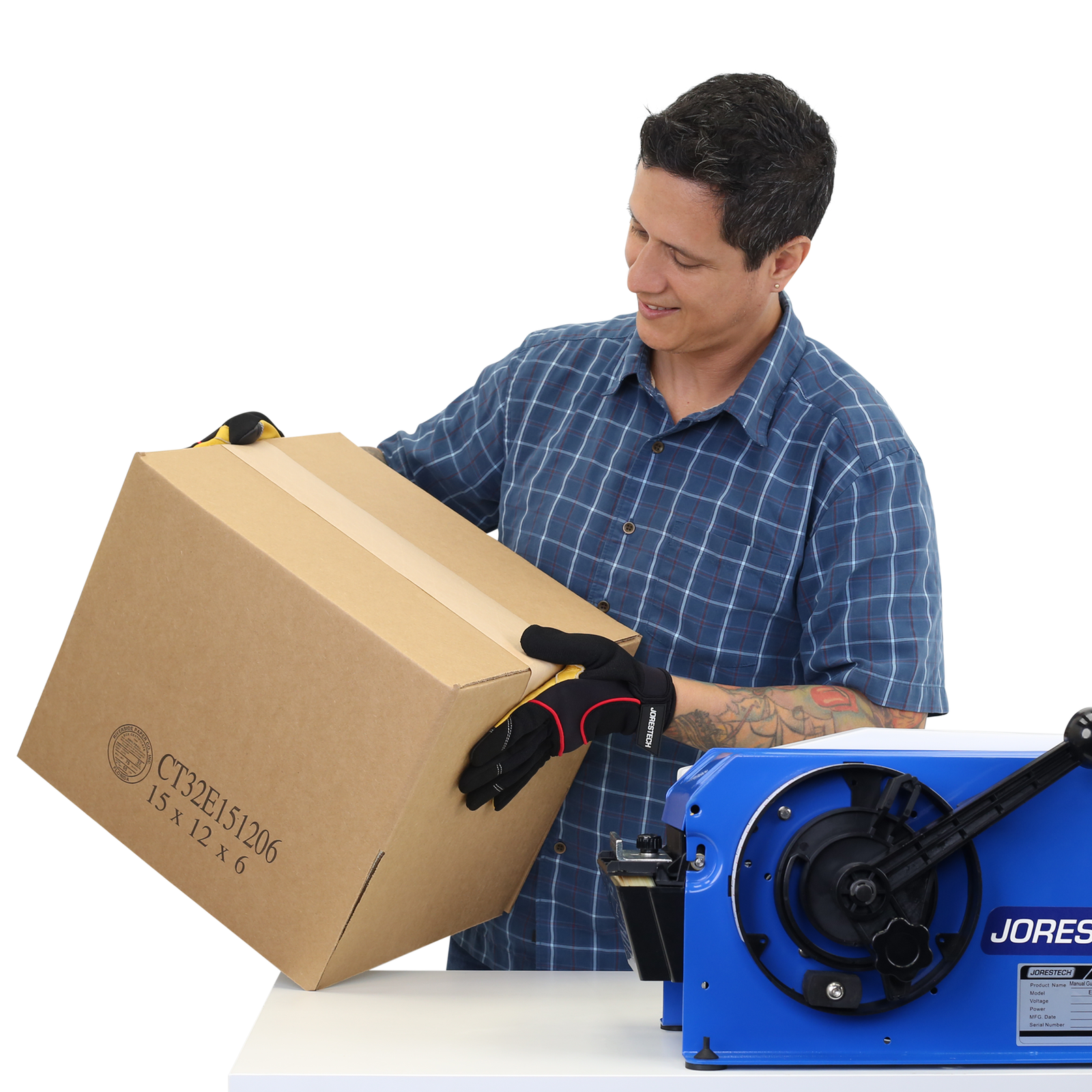Man showing one side of a card box closed with gummed kraft tape paper and the JORES TECHNOLOGIES® Dispenser placed on the same table. Showing production