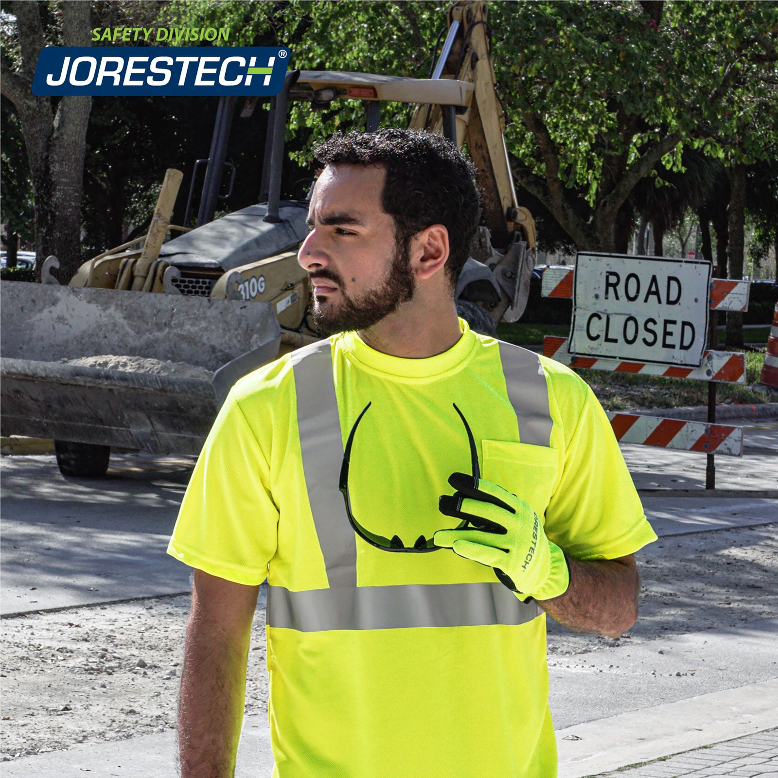 A worker wearing the short sleeve lime safety shirt with heat transfer reflective stipes for road construction 