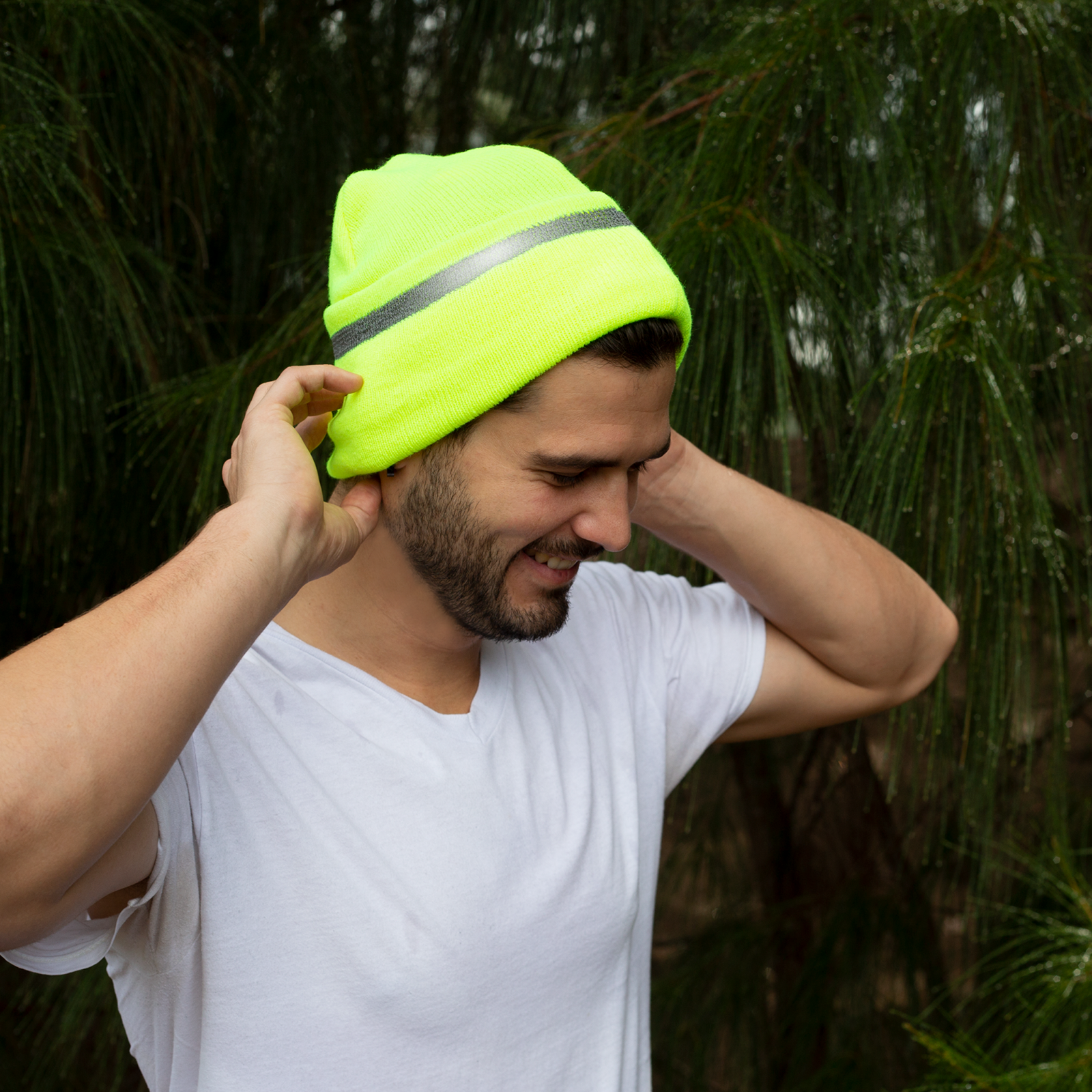 A man wearing the Hi-vis JORESTECH safety lime beanie hat for increase visibility