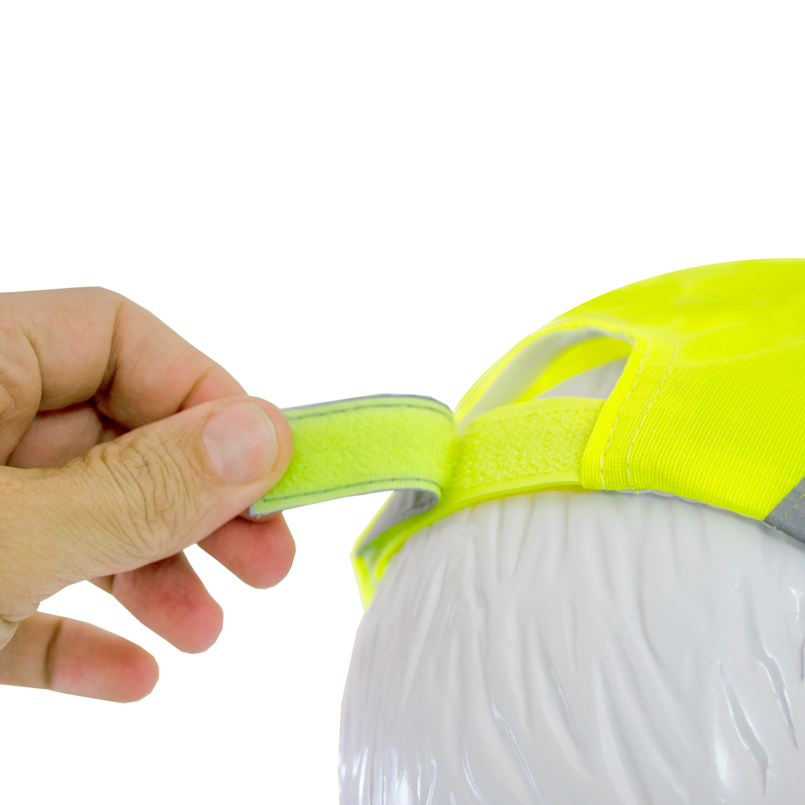 Close-up of a hand pulling the hook and look to adjust the width of the Hi-Vis JORESTECH lime cap