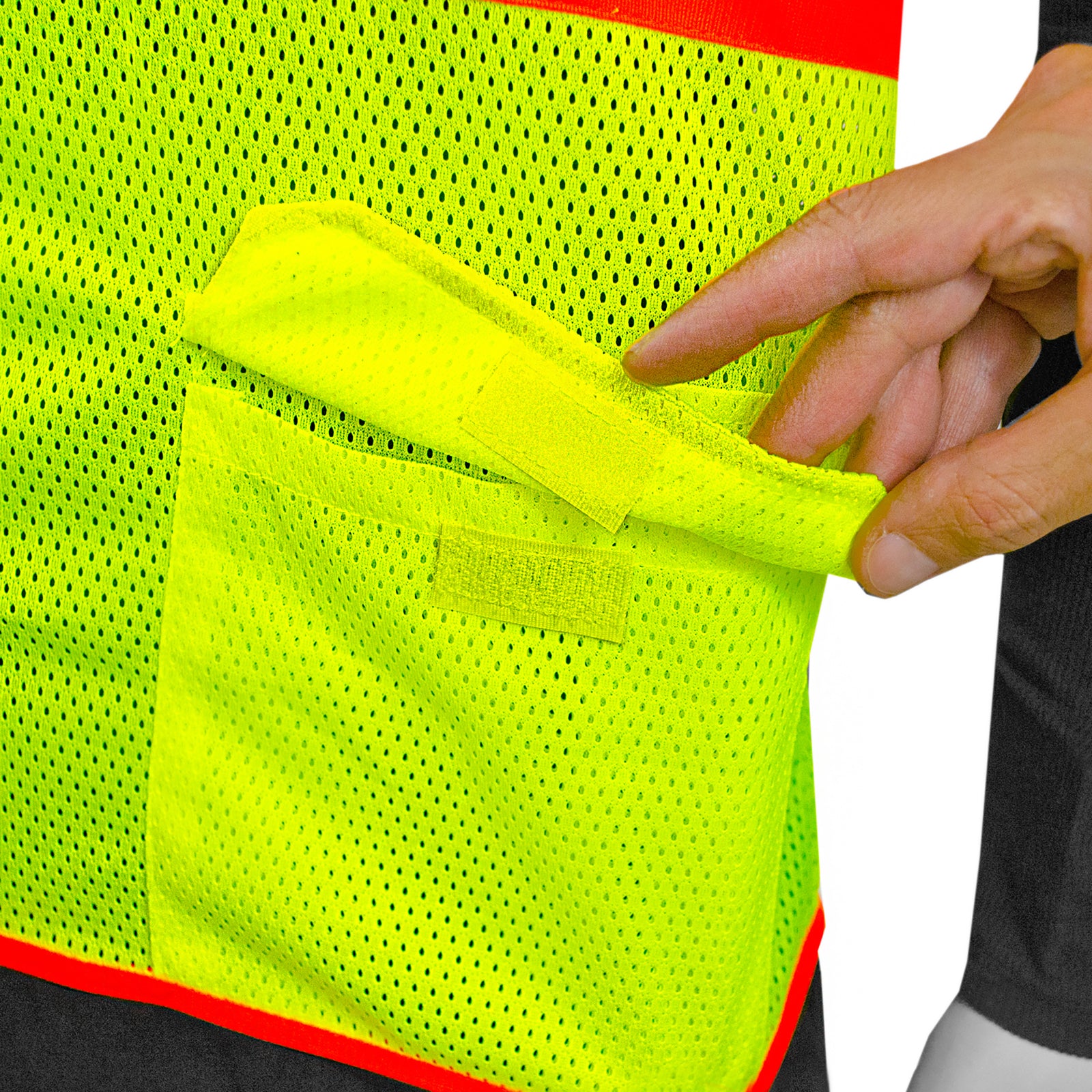 Close up of the pocket with hook and loop flap closure of the reflective safety vest