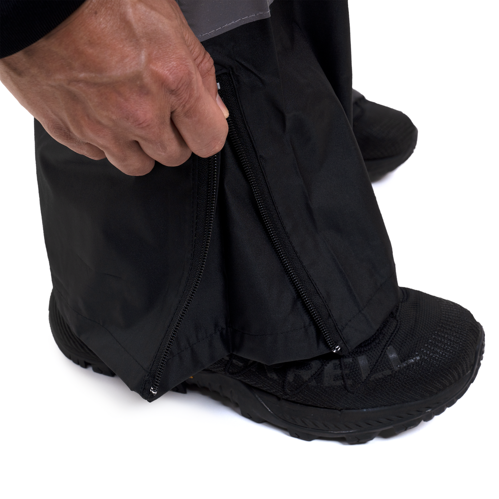 close up detail to show the zipper at boot level of the rain pants to expand the boot section