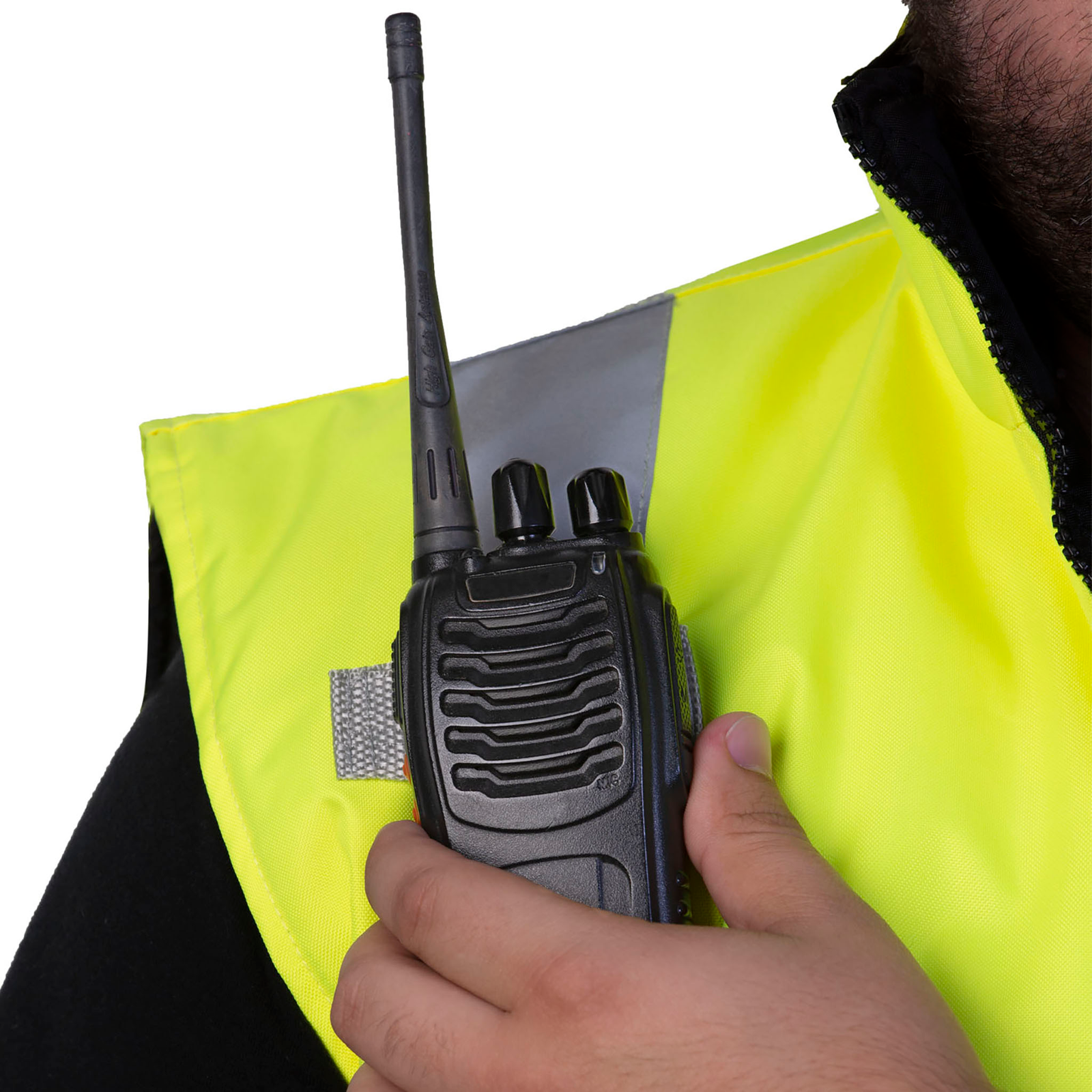 Close up showing the radio tabs on the lime insulated reflective safety vest