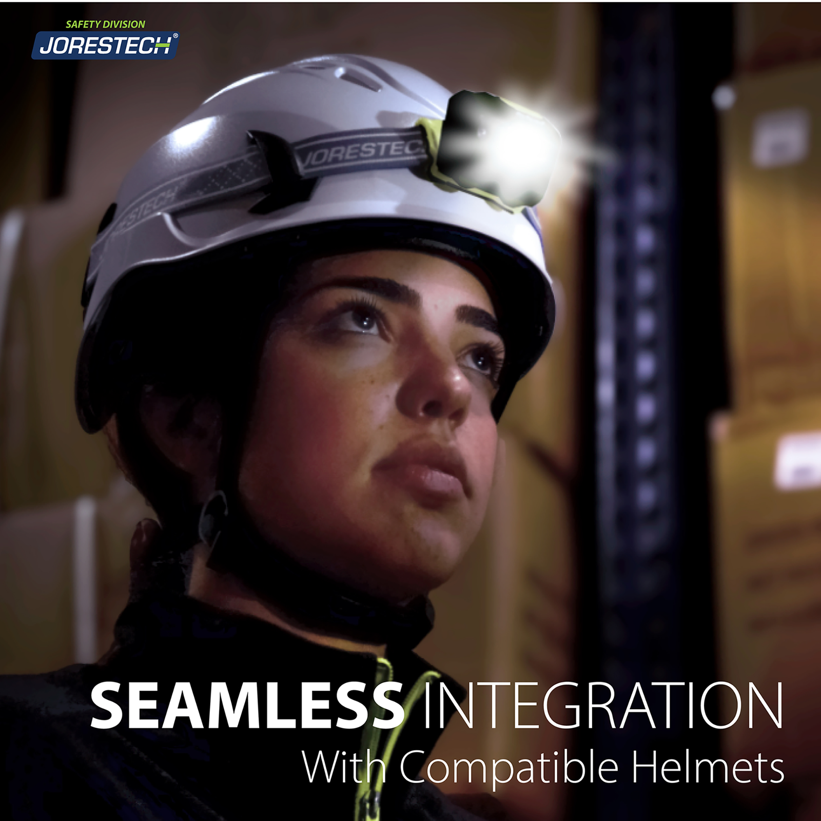A woman wearing a white hard hat with a compatible black headlamp. Text reads: seamless integration with compatible helmets. She is in a setting were the main light source is the head lamp.