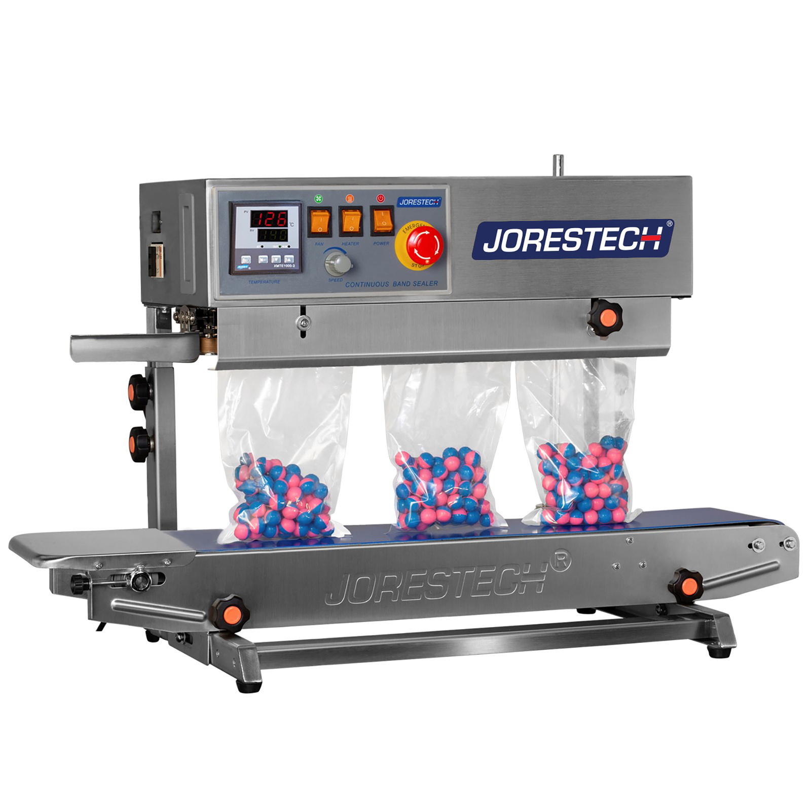 front view of the JORESTECH stainless steel left to right continuous band sealer. The table top Vertical bag sealer is sealing a production of plastic bags filled with blue and pink paint balls