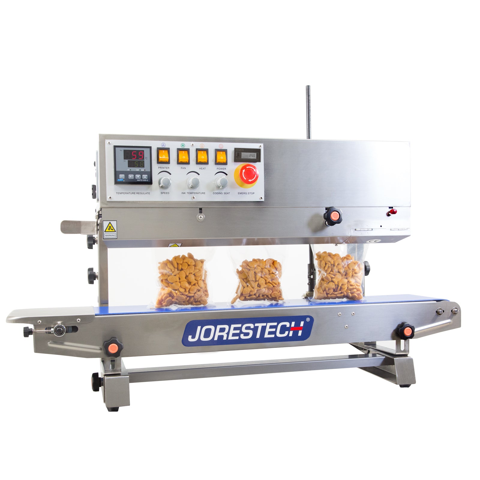 Left to right JORES TECHNOLOGIES® stainless steel  continuous band sealer with digital temperature control and coder sealing and coding several clear plastic bags filled with orange crackers in a vertical position