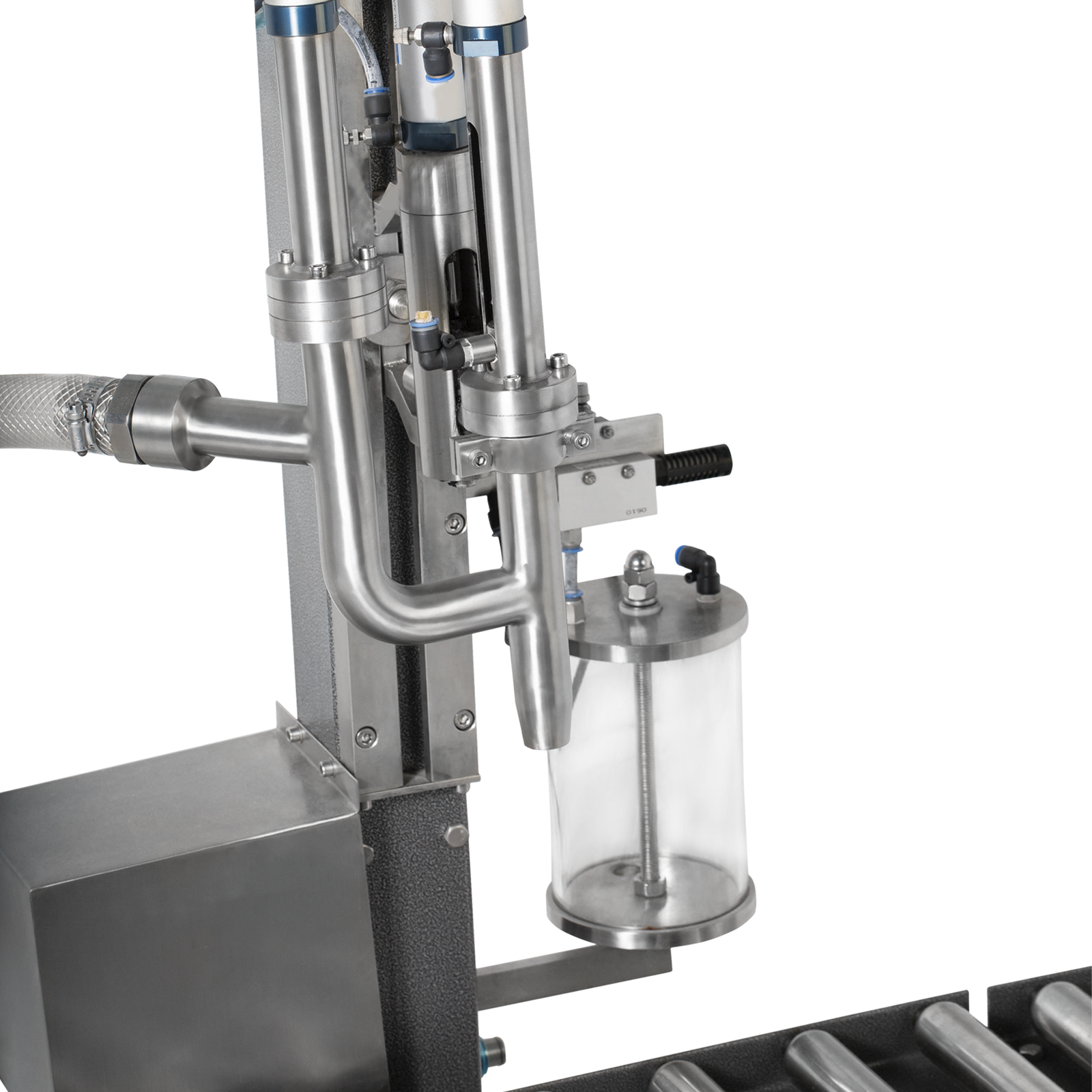 Closeup shows attachment of the suction hose and the dispensing nozzle of the jorestech liquid net weight filler.