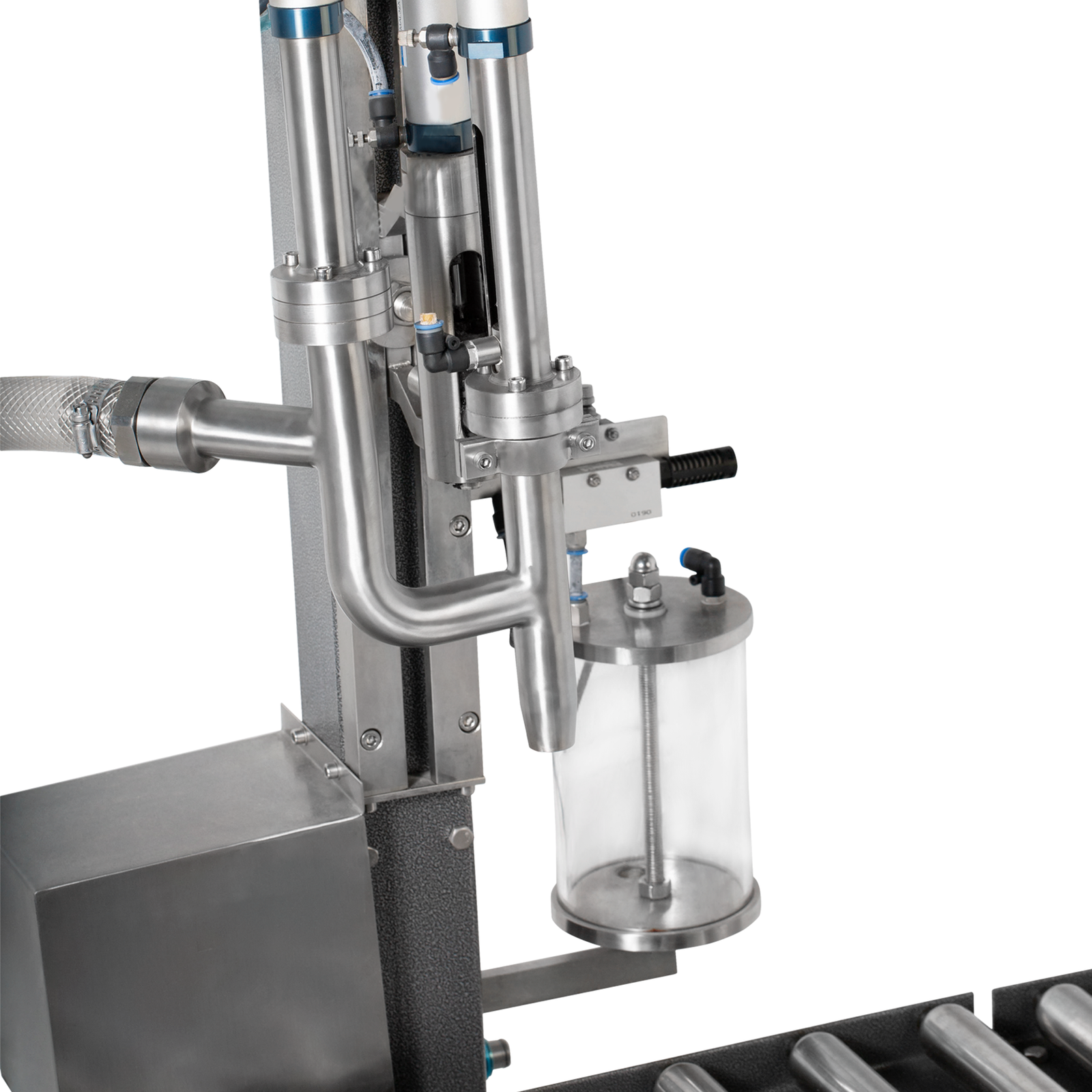 Closeup image shows attachment of the suction hose and the dispensing nozzle of the jorestech liquid net weight filler.