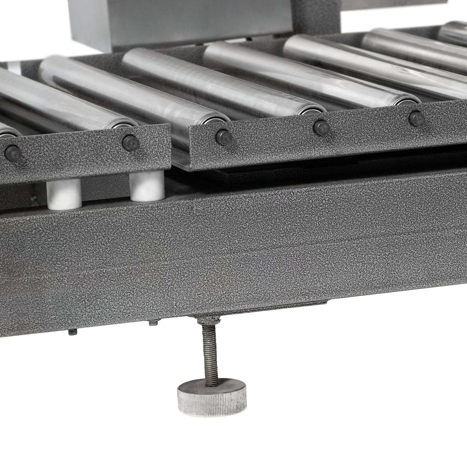 Closeup of the stainless steel rollers of the heavy duty conveyor and the height adjustable feet of the liquid net weight filler