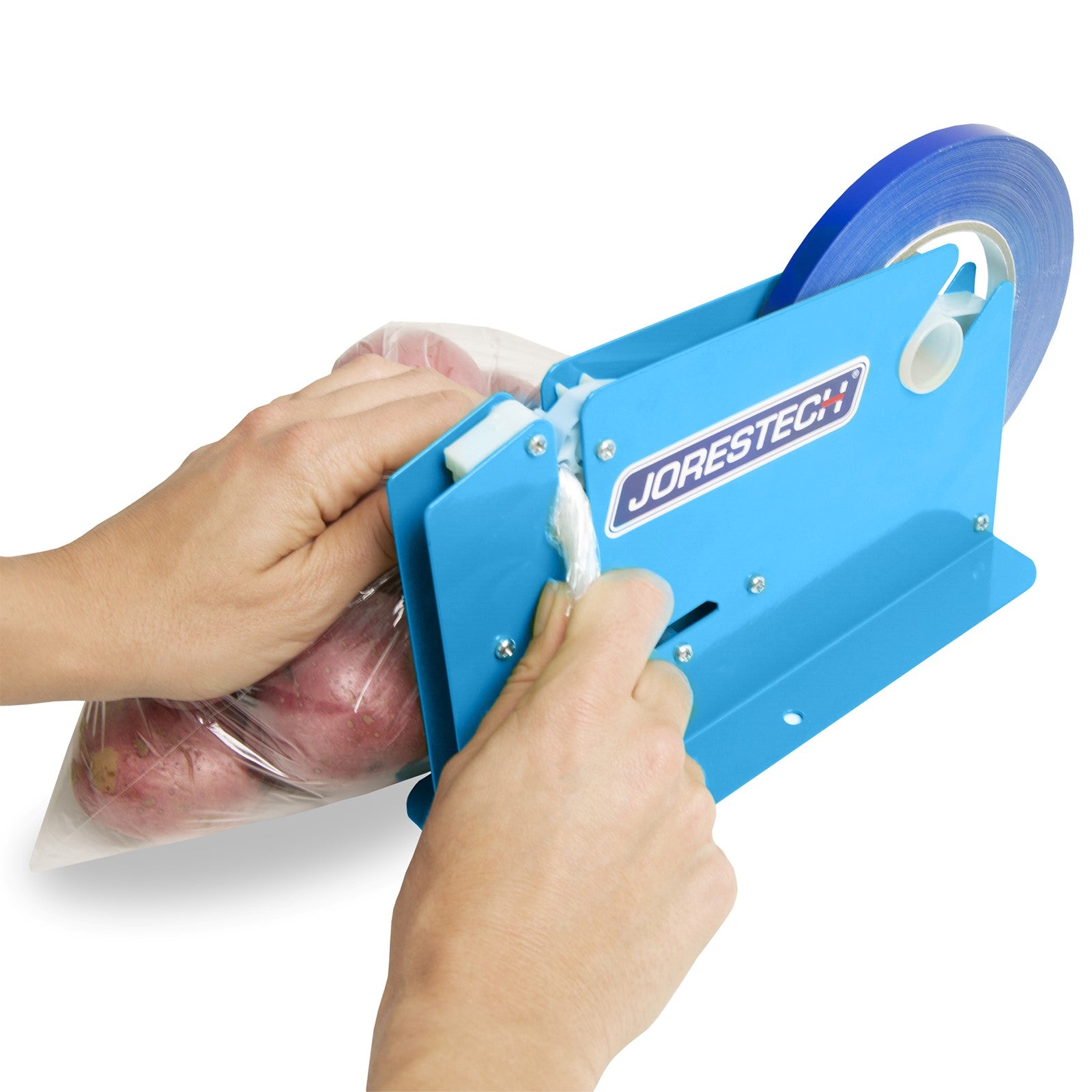 The hands of a person operating a JORESTECH manual bag taper. The person using the machine to close a bag filled with potatoes.                