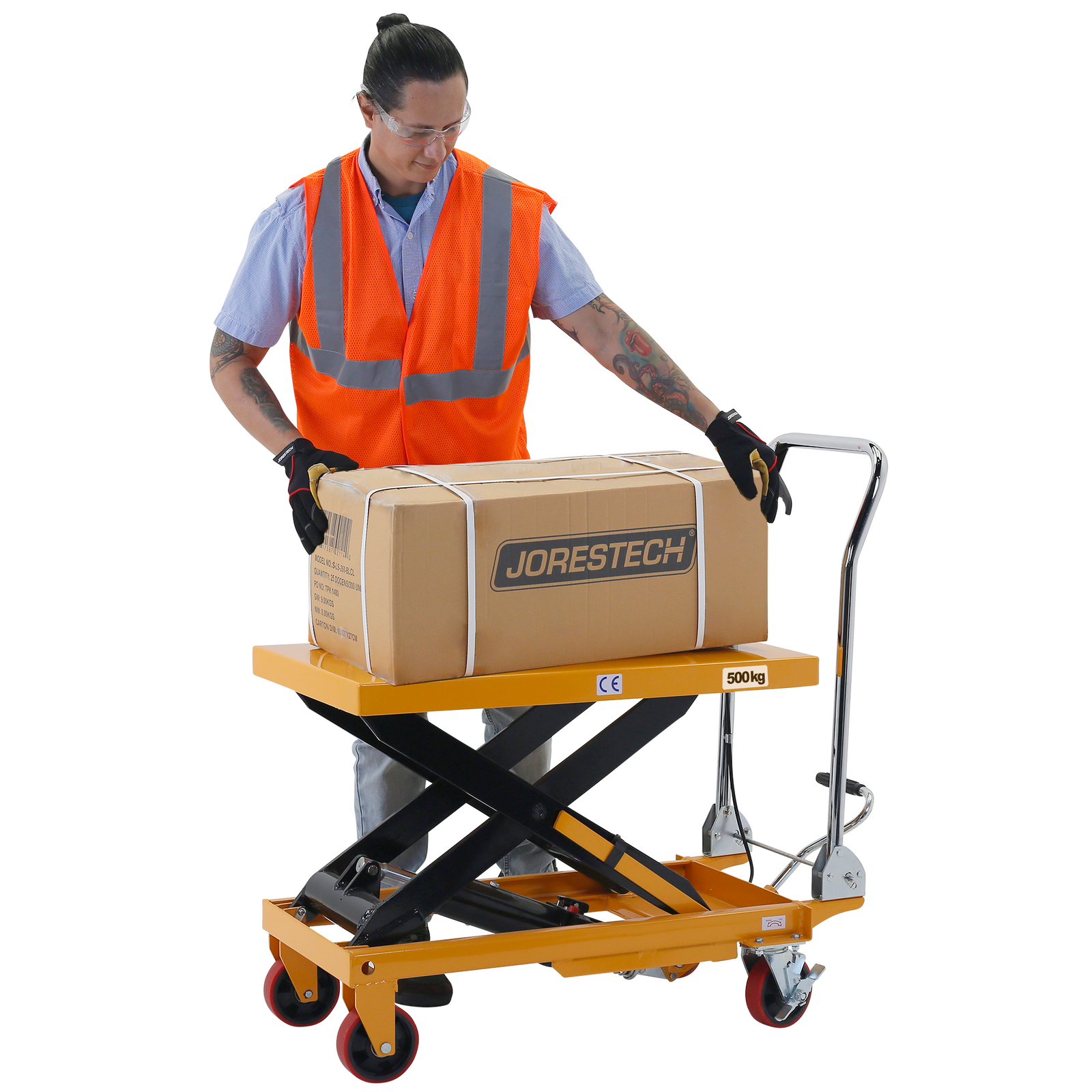 A man wearing an orange safety vest is removing a heavy box from the table lift at a comfortable height because the JORESTECH scissor table for 1100 pounds is lifted