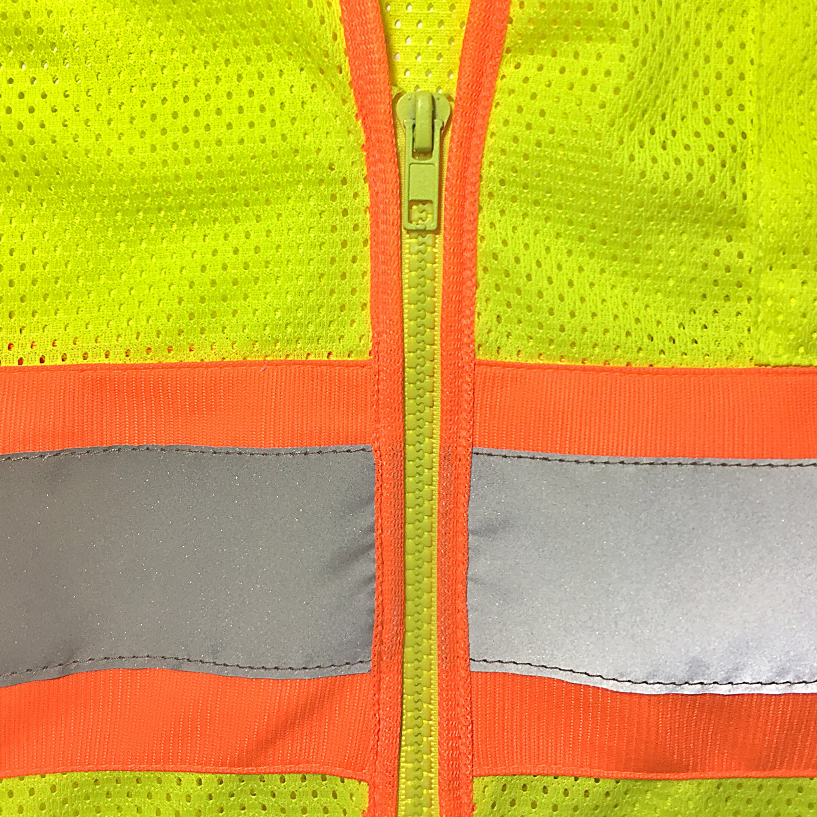 Close up of the zipper, mesh fabric and reflective strips of the lime and orange JORESTECH reflective vest