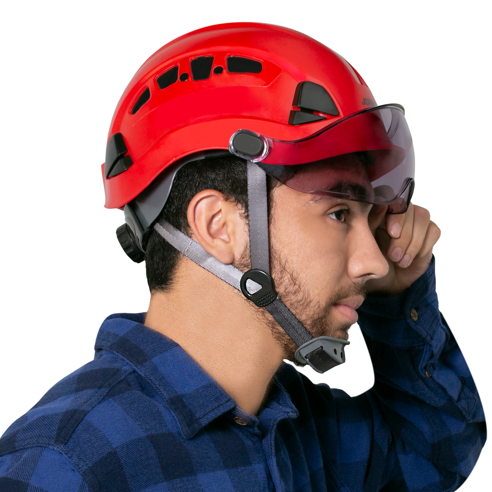 Man wearing a red hard hat with a JORESTECH® smoke eye shield installed on the hard hat, The man is pulling the eye shield upwards away from his face