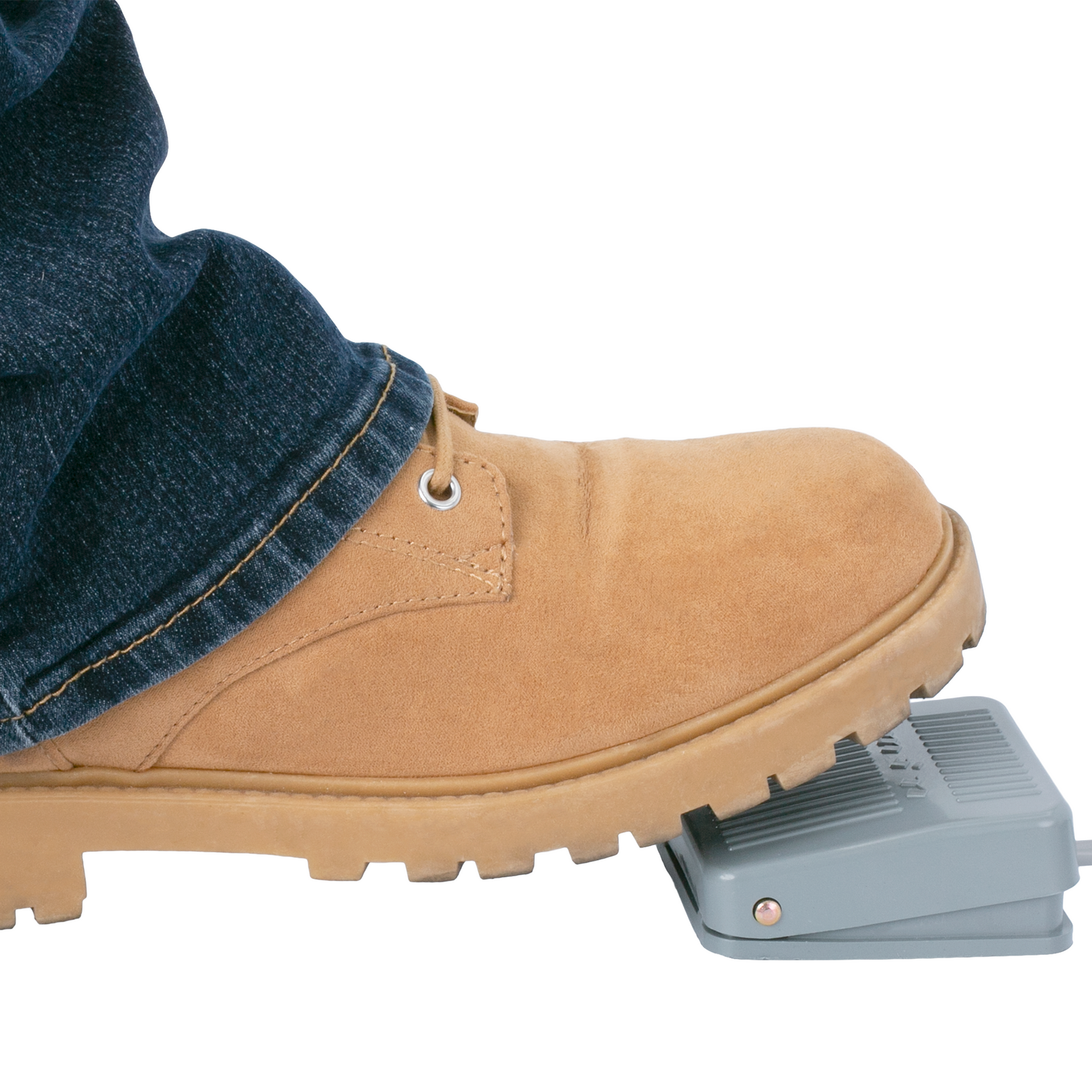 The foot of person stepping on the foot pedal of the hot foil printer