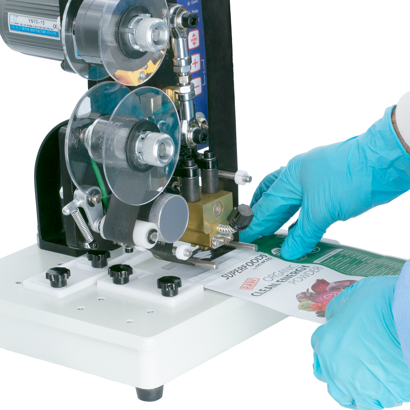 Close up of a person placing a bag so that it is printed by the JORESTECH semi automatic digital hot stamping printer