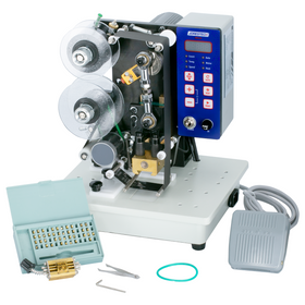 Front of the JORESTECH semi-automatic digital hot foil stamping printer and its foot pedal. The machine has the hot ink roll installed. Complete set of types,  installation tools and a type holder also shown included with the machine