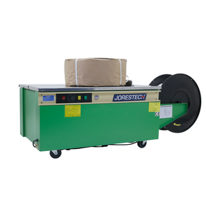 JORES TECHNOLOGIES® packaging machine used for poly strapping with an oddly-shaped object that has been wrapped with brown paper and secured with polypropylene strapping bands