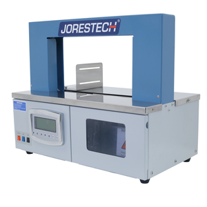 Diagonal view of a grey and blue JORESTECH® Tabletop banding machine for paper and plastic bands. 
