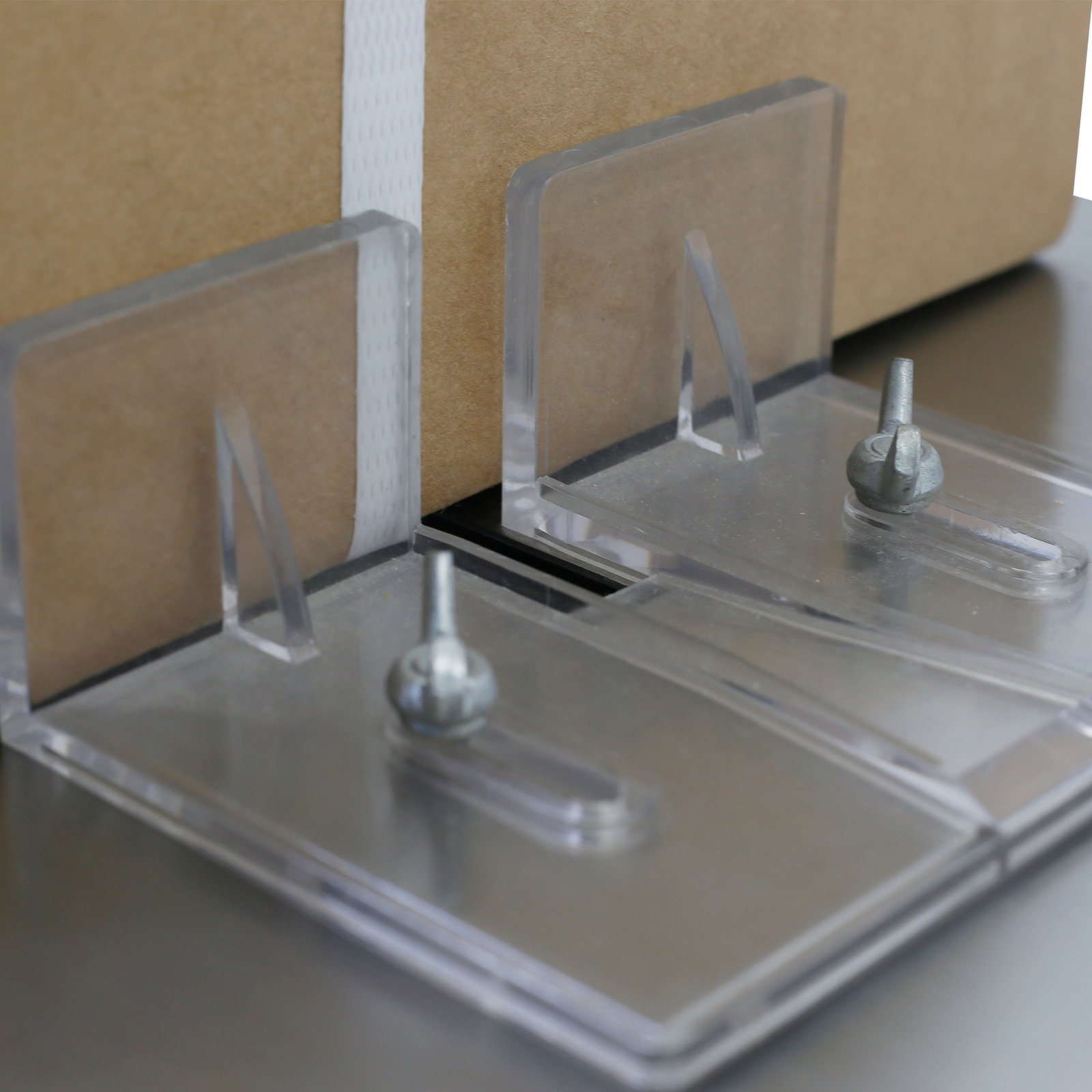 Close-up of the product placement guides on a JORES TECHNOLOGIES® poly strapping machine