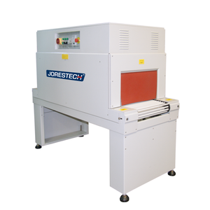 A shrink wrapping heat tunnel machine over white background.