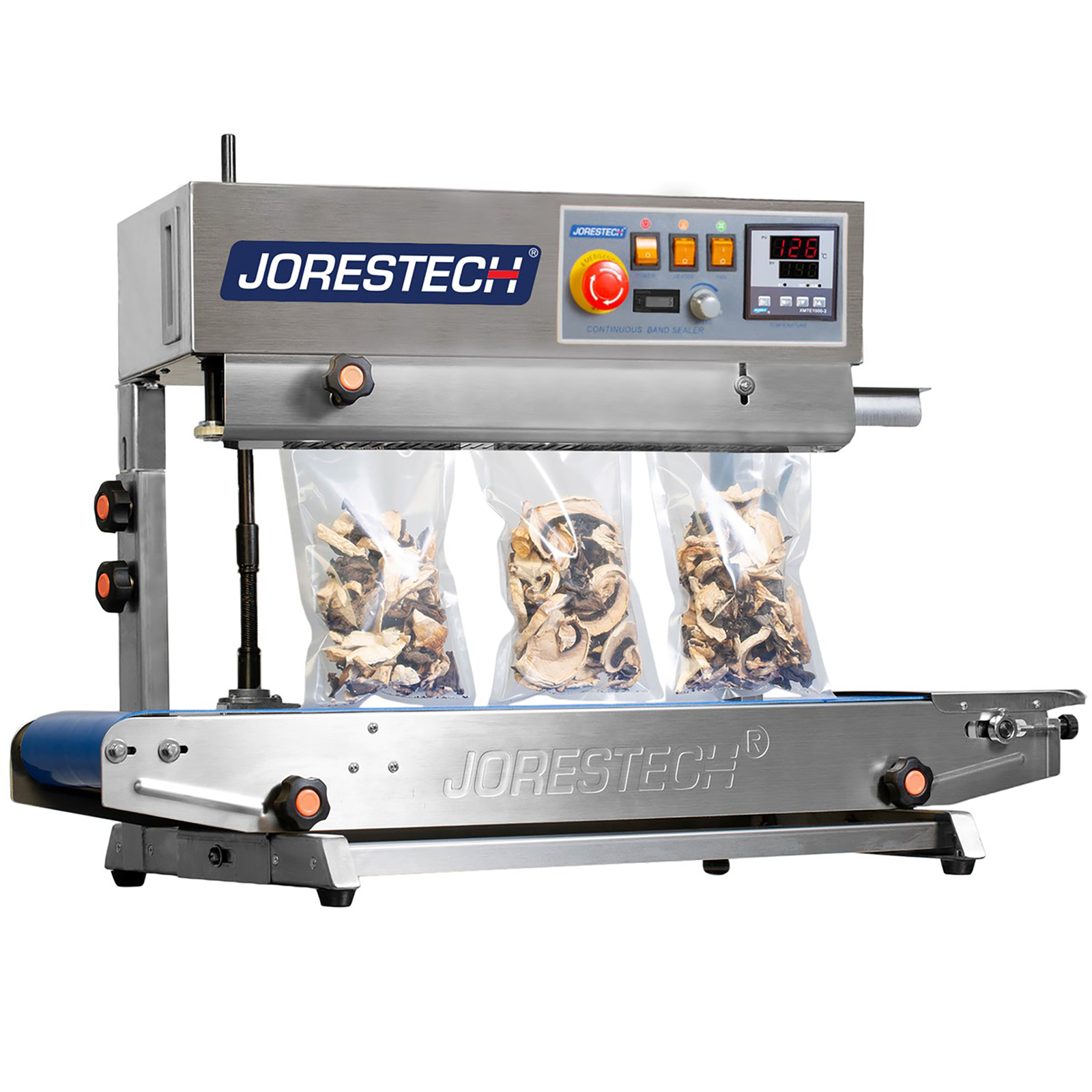 front of the JORESTECH stainless-steel continuous band sealing machine set for vertical applications while sealing 3 clear plastic bags filled with mushrooms