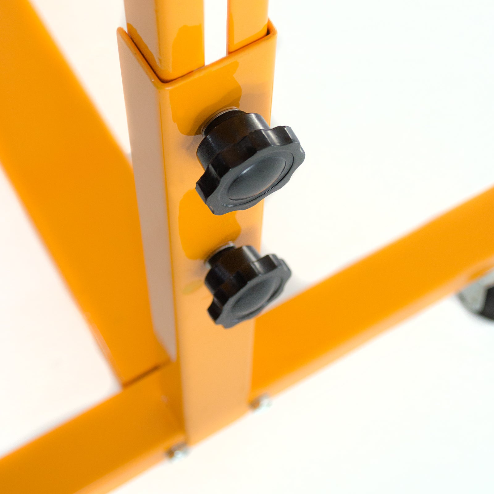 close of black adjustable knobs on yellow stand for continuous band sealer