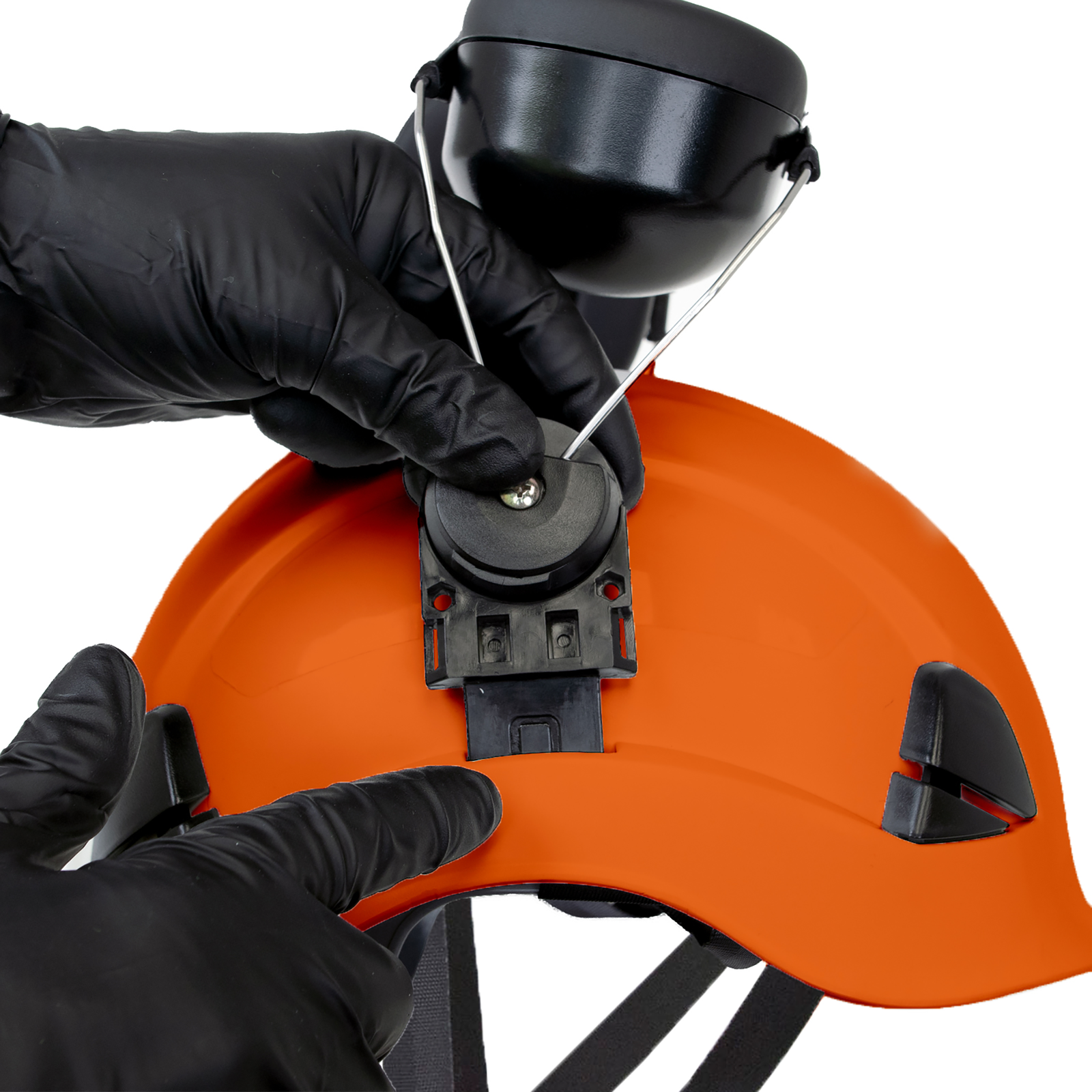 Close-up of a person mounting a pair of earmuffs onto the Jorestech orange 3-in-1 helmet