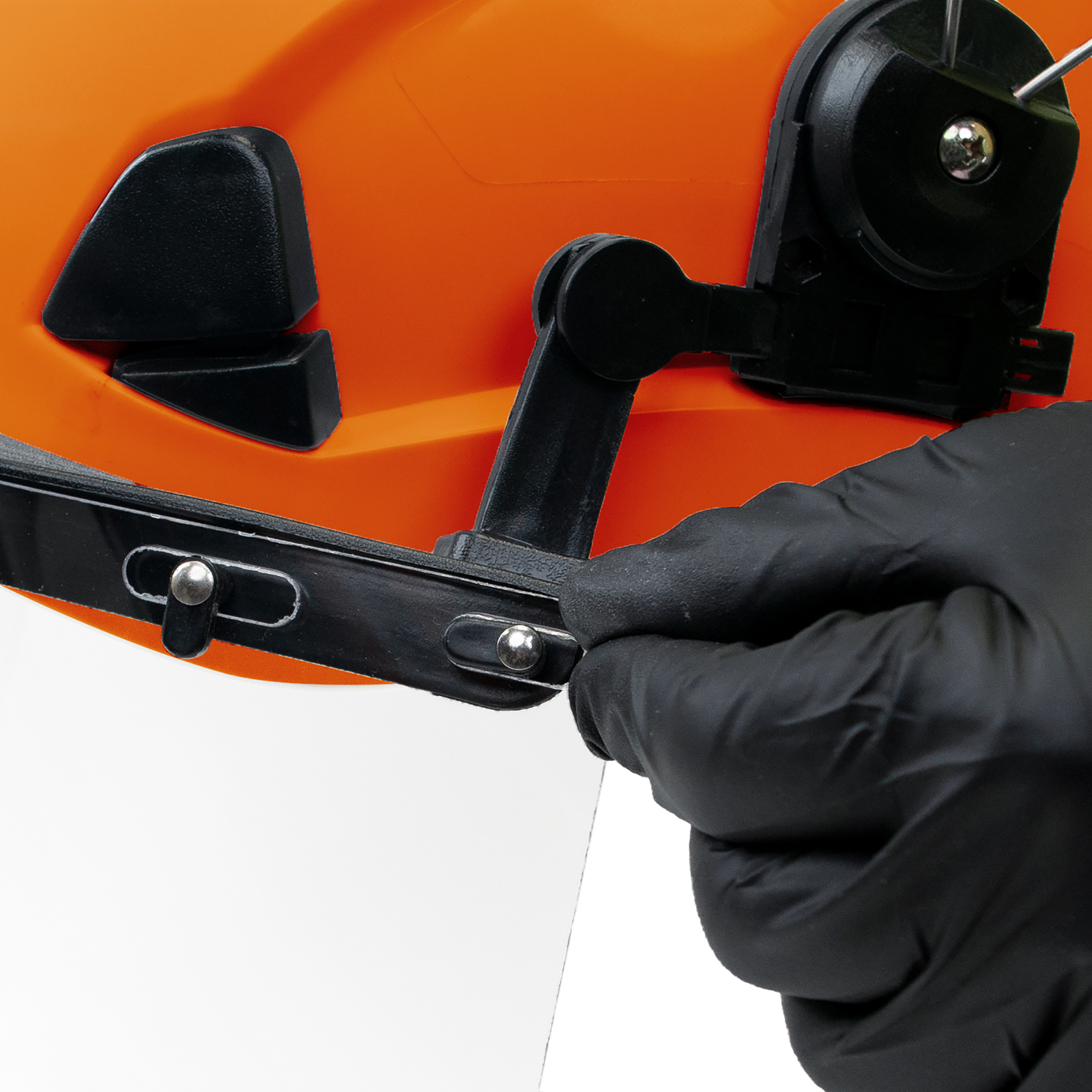 Close-up Image of a person mounting a face shield onto the Jorestech orange 3-in-1 helmet
