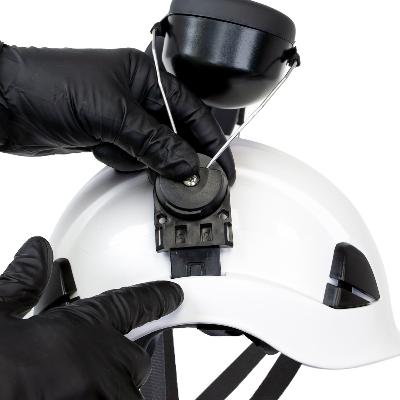 Close-up of a person mounting a pair of earmuffs onto the Jorestech white 3-in-1 helmet