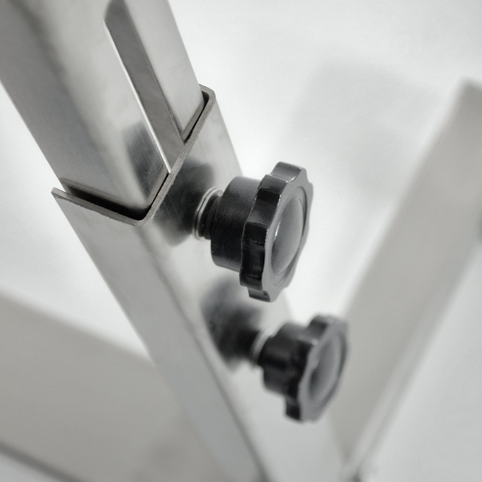 black knob for adjusting height on stainless steel stand for continuous band sealer