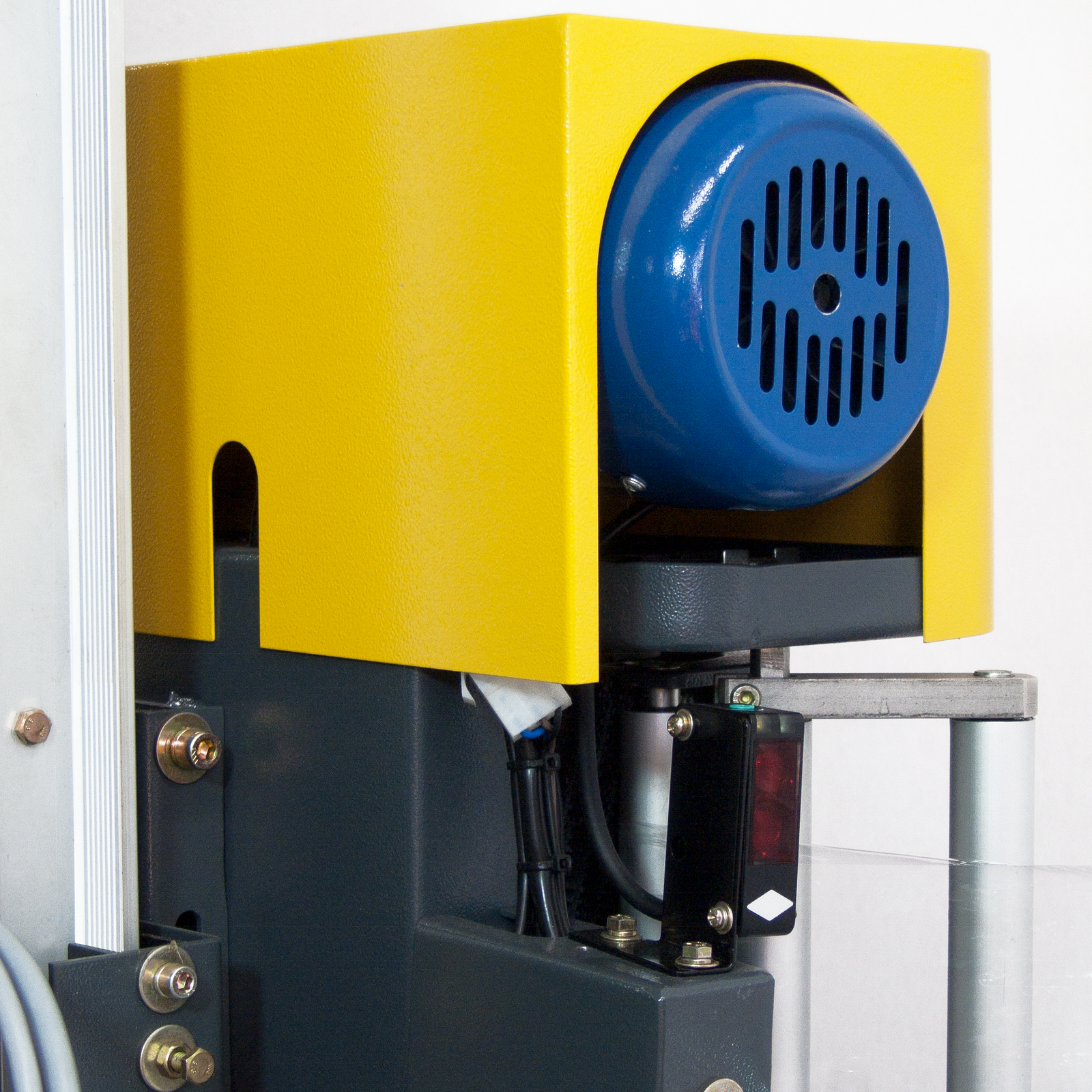 Close-up details of a stretch wrapping machine for boxes.