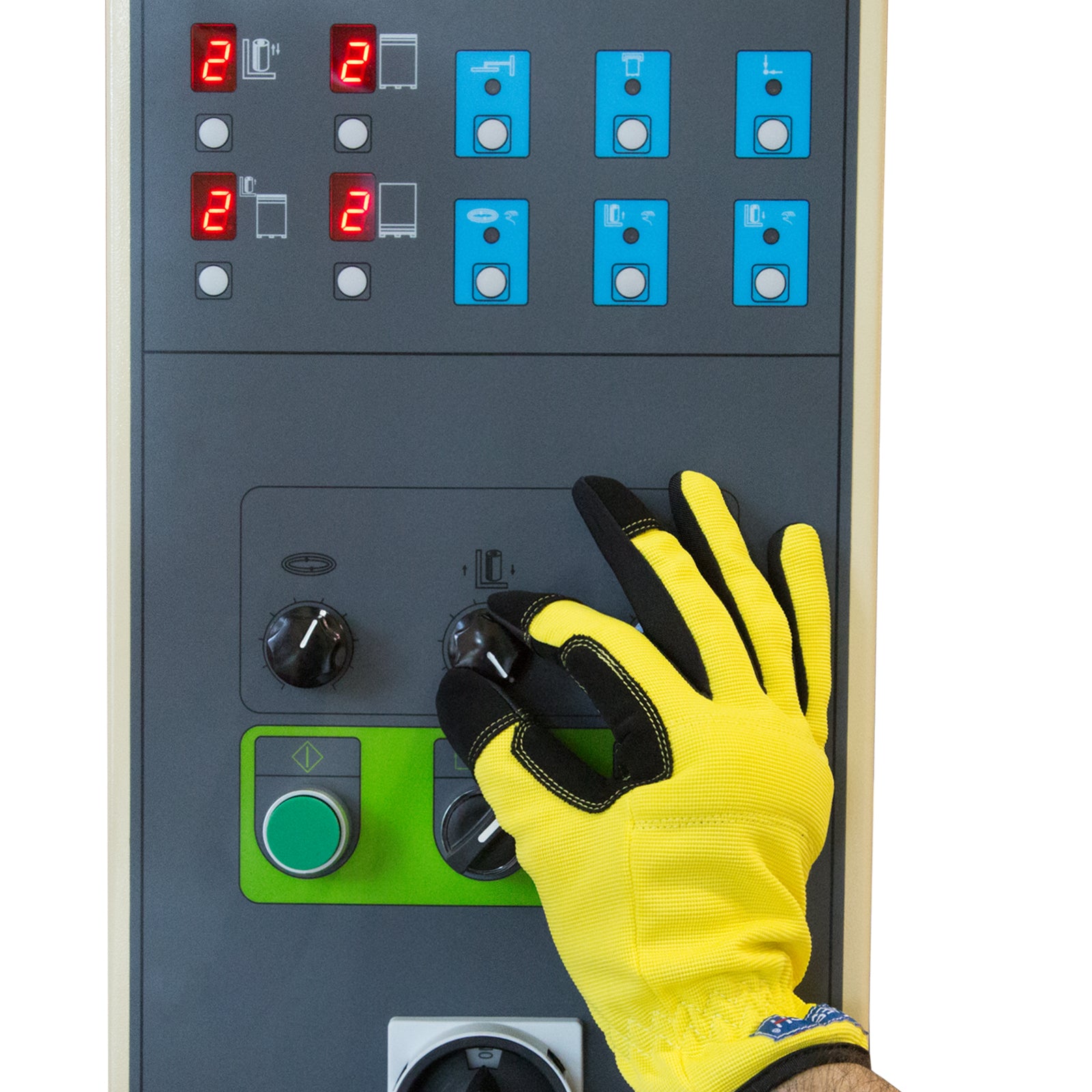 The hand of a worker wearing yellow protective glove adjusting one of the dial control knobs on the control panel on a turntable pallet stretch wrapper with pre stretching