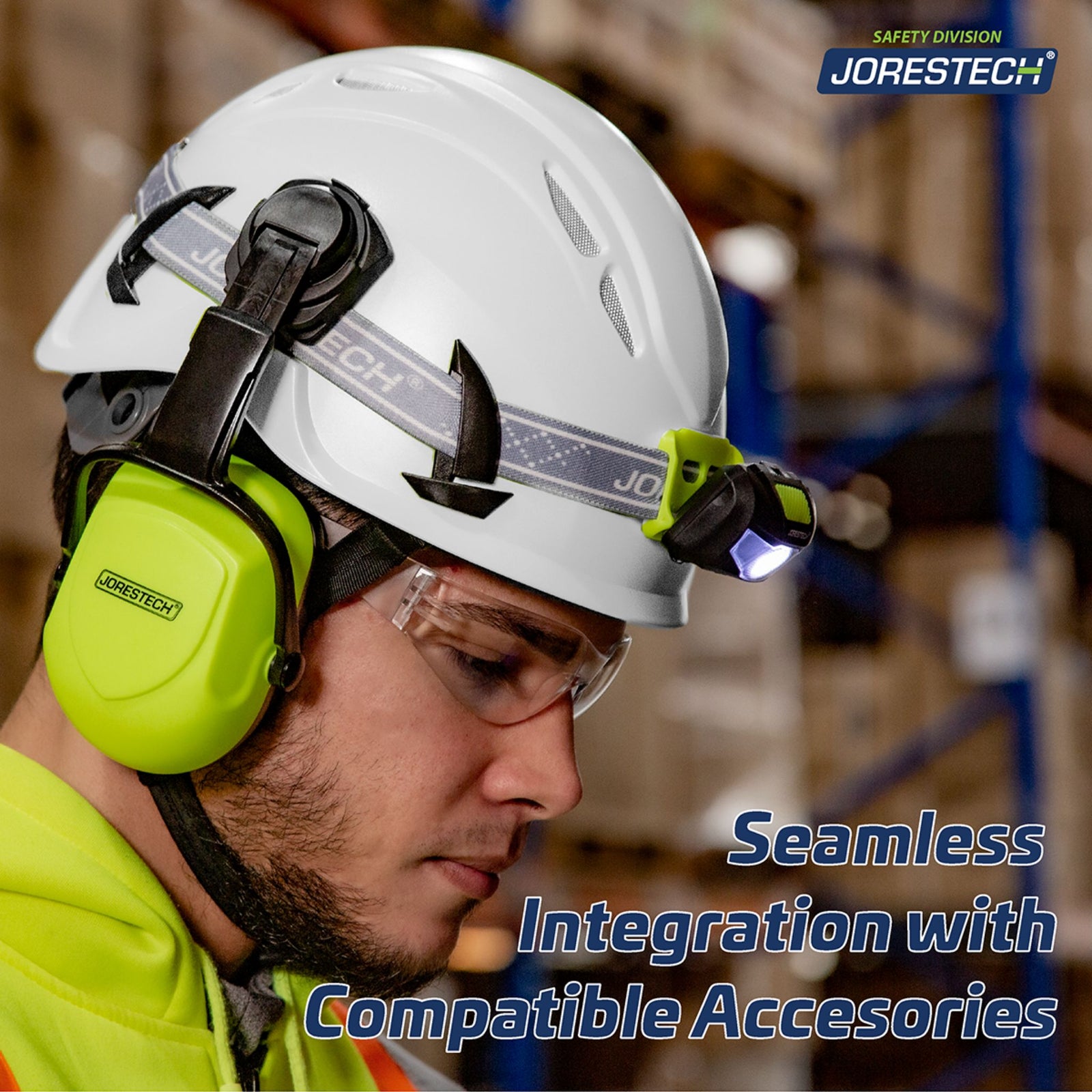 A worker wearing the white ventilated hard hat with a blue text that reads: Seamless Integration with compatible accessories. The hard hat has a headlamp attachment as well as a pair of lime earmuffs